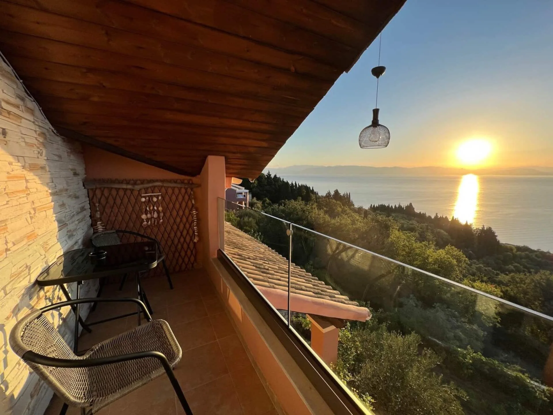 Sunset over the Ionian Sea from Nakis Dream View balcony